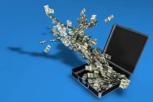 Open briefcase with cash and a money tree, symbolizing salary transparency in job advertisements.
